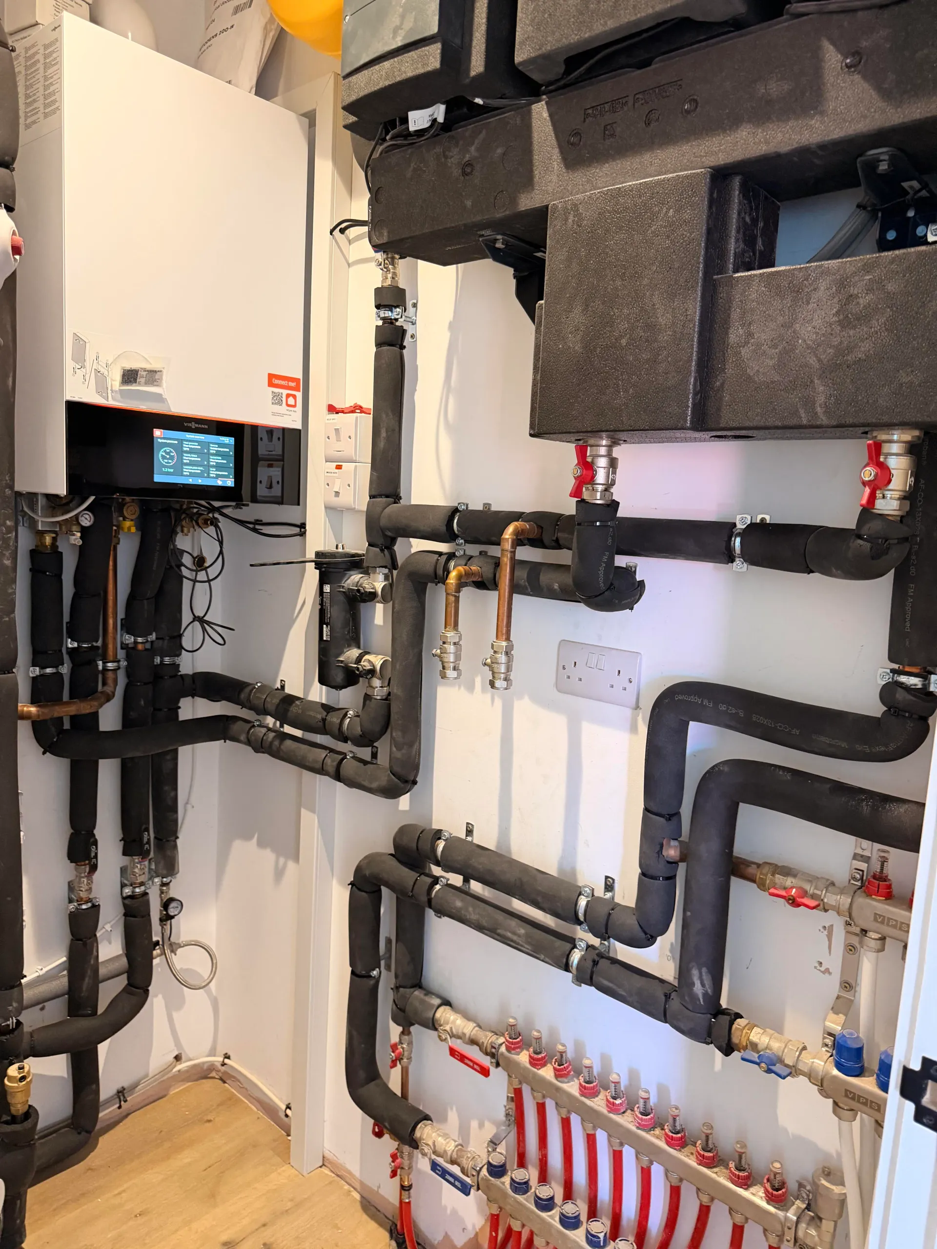 Viessmann boiler, cylinder and underfloor heating manifold in a plant room