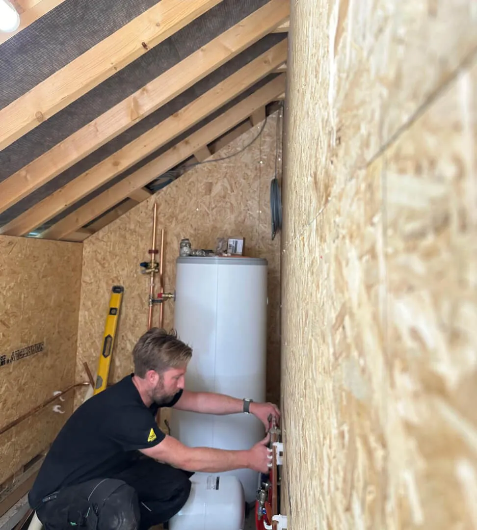 Heating engineer working on a home boiler